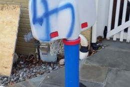 On Friday night and Saturday, unknown vandals spray-painted racial images on several items in Montgomery County, Maryland. (WTOP/Allison Keyes)