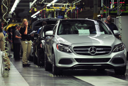 FILE - In this June 18, 2014 file photo, workers produce C-Class sedans at the Mercedes plant near Tuscaloosa, Ala. The National Labor Relations Board on Wednesday, Nov. 26, 2014 upheld a ruling that Mercedes violated federal labor laws by stopping United Auto Workers union supporters from handing out literature inside its Alabama plant. (AP Photo/AL.com, Tamika Moore, File)