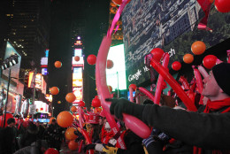 Balloons are released as revelers take part in the New Year's Eve festivities Wednesday Dec. 31, 2014, in New York's Times Square. (AP Photo/Tina Fineberg)
