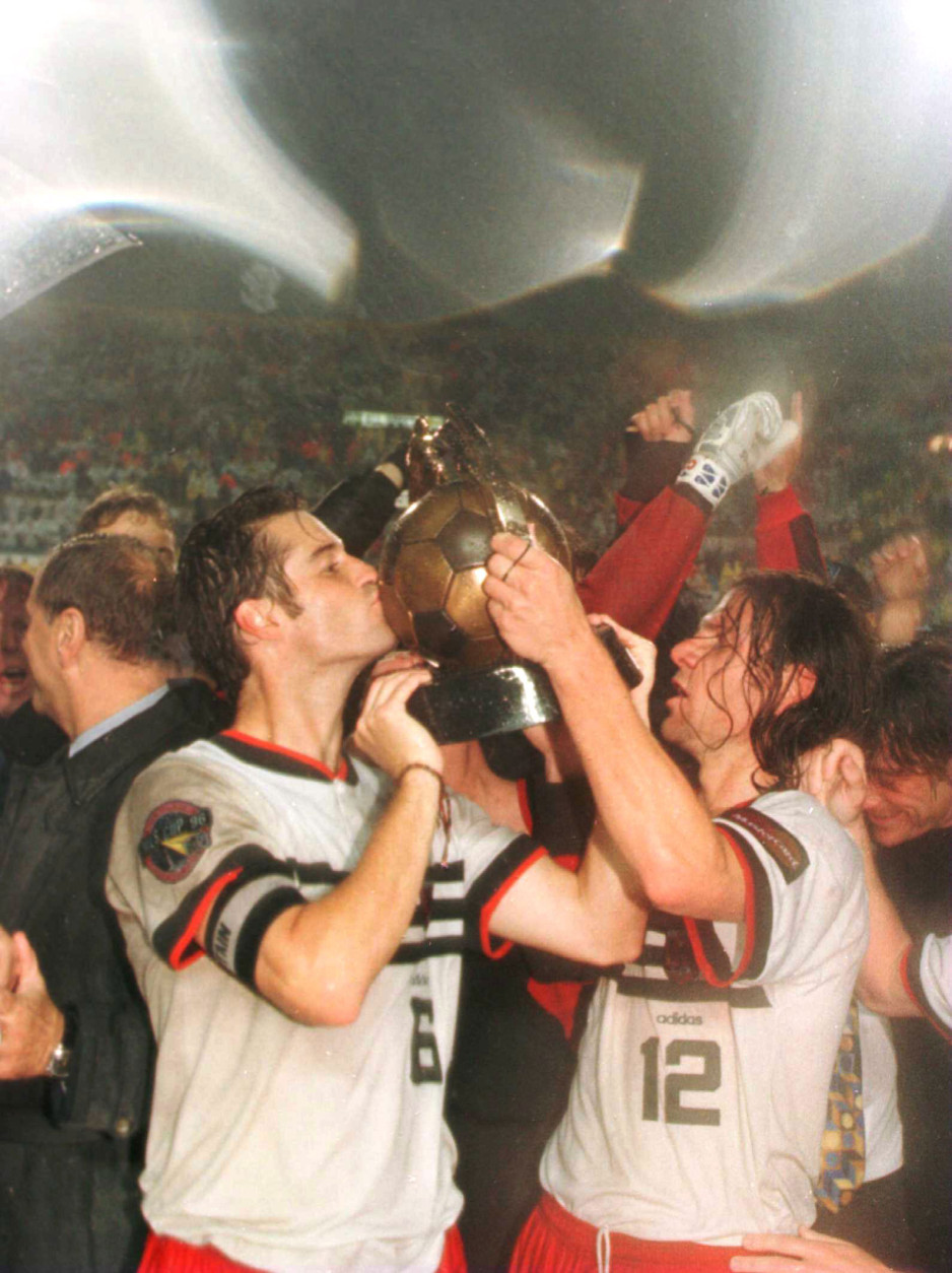 John Harkes and Jeff Agoos of DC United hoist the Alan I Rothenberg Cup after their team defeated the Los Angeles Galaxy in the Major League Soccer MLS Championship game at Foxboro Stadium in Foxboro, Massachusetts. 