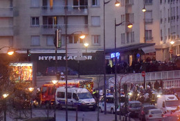  French riot policemen enter a kosher deli during a hostage situation at Port de Vincennes on January 9, 2015 in Paris, France. According to reports at least five people were taken hostage in a kosher deli in the Port de Vincennes area of Paris. A huge manhunt for the two suspected gunmen in Wednesday's deadly attack on Charlie Hebdo magazine has entered its third day. (Photo by Antoine Antoniol/Getty Images)