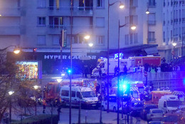  French firemen and emergency doctors enter a kosher deli during a hostage situation at Port de Vincennes on January 9, 2015 in Paris, France. According to reports at least five people were taken hostage in a kosher deli in the Port de Vincennes area of Paris. A huge manhunt for the two suspected gunmen in Wednesday's deadly attack on Charlie Hebdo magazine has entered its third day. (Photo by Antoine Antoniol/Getty Images)