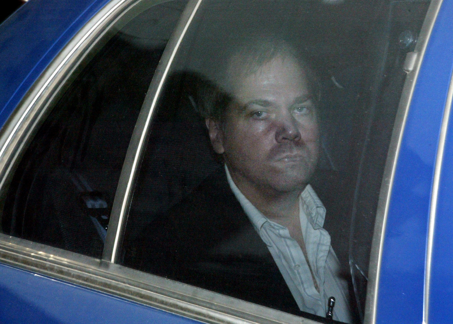 FILE - In this Nov. 19, 2003 file photo, John Hinckley Jr. arrives at the U.S. District Court House in Washington. Hinckley, who shot President Ronald Reagan in 1981, has behaved well over the past year when he's been freed from a Washington mental hospital to visit his mother in Virginia, according to U.S. Secret Service reports. Hinckley, 57, has been allowed to go to mother's home since 2006, and the length of his visits has increased over time. (AP Photo/Evan Vucci, File)
