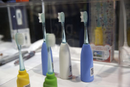 The Vigilant Rainbow smart toothbrush is on display at CES Unveiled, a media preview event for CES International, Sunday, Jan. 4, 2015, in Las Vegas. The toothbrush connects to a smartphone to keep records on brushing and allow for interactive games. (AP Photo/John Locher)