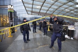 Officers secure the entrance to LEnfant Plaza Station in Washington, Monday, Jan. 12, 2015, following an evacuation. Metro officials say one of the busiest stations in downtown Washington has been evacuated because of smoke. Authorities say the source of the smoke is unknown. (AP Photo/Manuel Balce Ceneta)