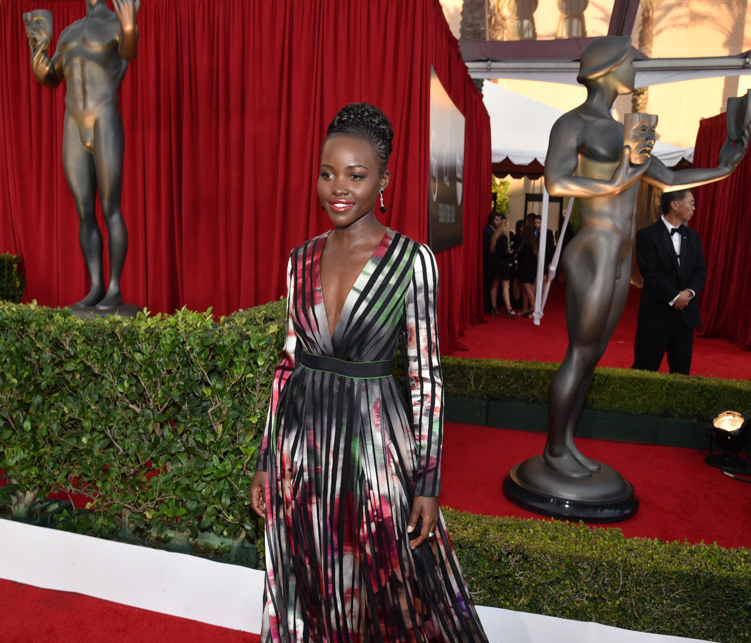 Lupita Nyong'o arrives at the 21st annual Screen Actors Guild Awards at the Shrine Auditorium on Sunday, Jan. 25, 2015, in Los Angeles. (Photo by John Shearer/Invision/AP)