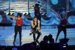 Prince Royce performs during the Miss Universe pageant in Miami, Sunday, Jan. 25, 2015. (AP Photo/Wilfredo Lee)