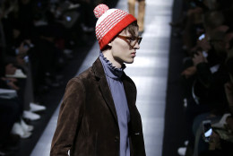 A model wears a creation for Gucci men's Fall - Winter 2015 - 2016 collection, part of the Milan Fashion Week, unveiled in Milan, Italy, Monday, Jan. 19, 2015. (AP Photo/Antonio Calanni)