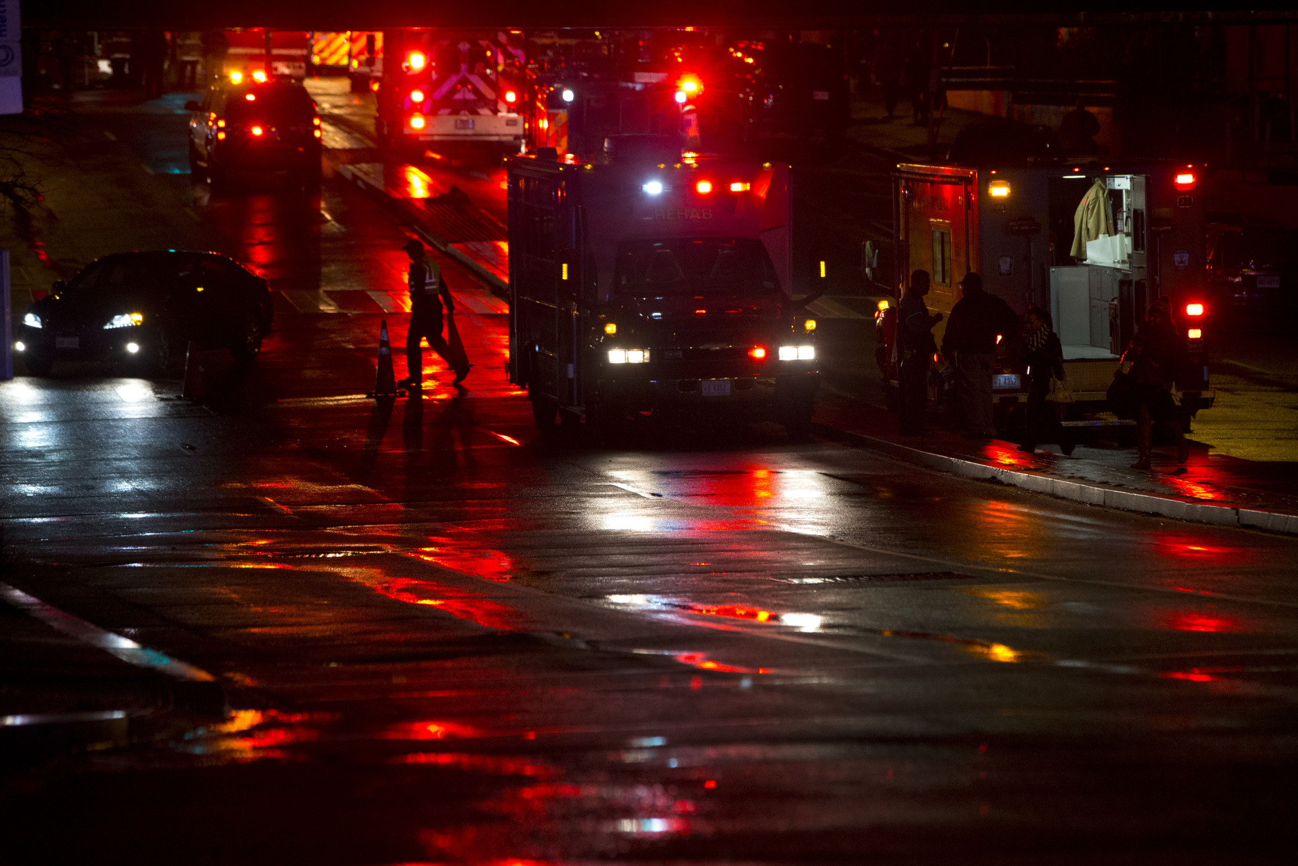 Firefighters begin to remove cones from the scene after people were evacuated from a smoke filled Metro subway tunnel in Washington, Monday, Jan. 12, 2015. Metro officials say one of the busiest stations in downtown Washington has been evacuated because of smoke. Authorities say the source of the smoke is unknown. (AP Photo/Jacquelyn Martin)