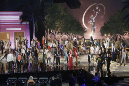 Miss Universe contestants stand in place during a break in rehearsals, Saturday, Jan. 24, 2015, at Florida International University in Miami. The Miss Universe pageant will be held Jan. 25, in Miami. (AP Photo/Wilfredo Lee)