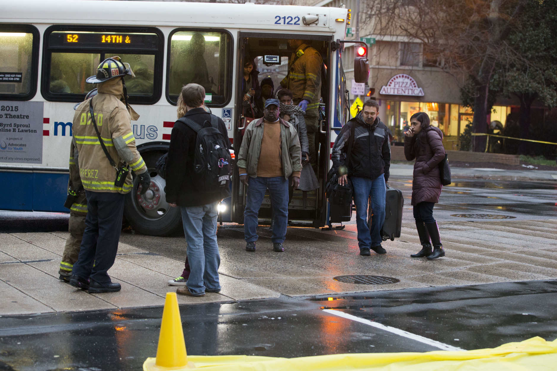 Coughing people are sorted for triage needs after being  evacuated from a smoke filled Metro subway tunnel in Washington, Monday, Jan. 12, 2015.  Metro officials say one of the busiest stations in downtown Washington has been evacuated because of smoke.  Authorities say the source of the smoke is unknown.   (AP Photo/Jacquelyn Martin)