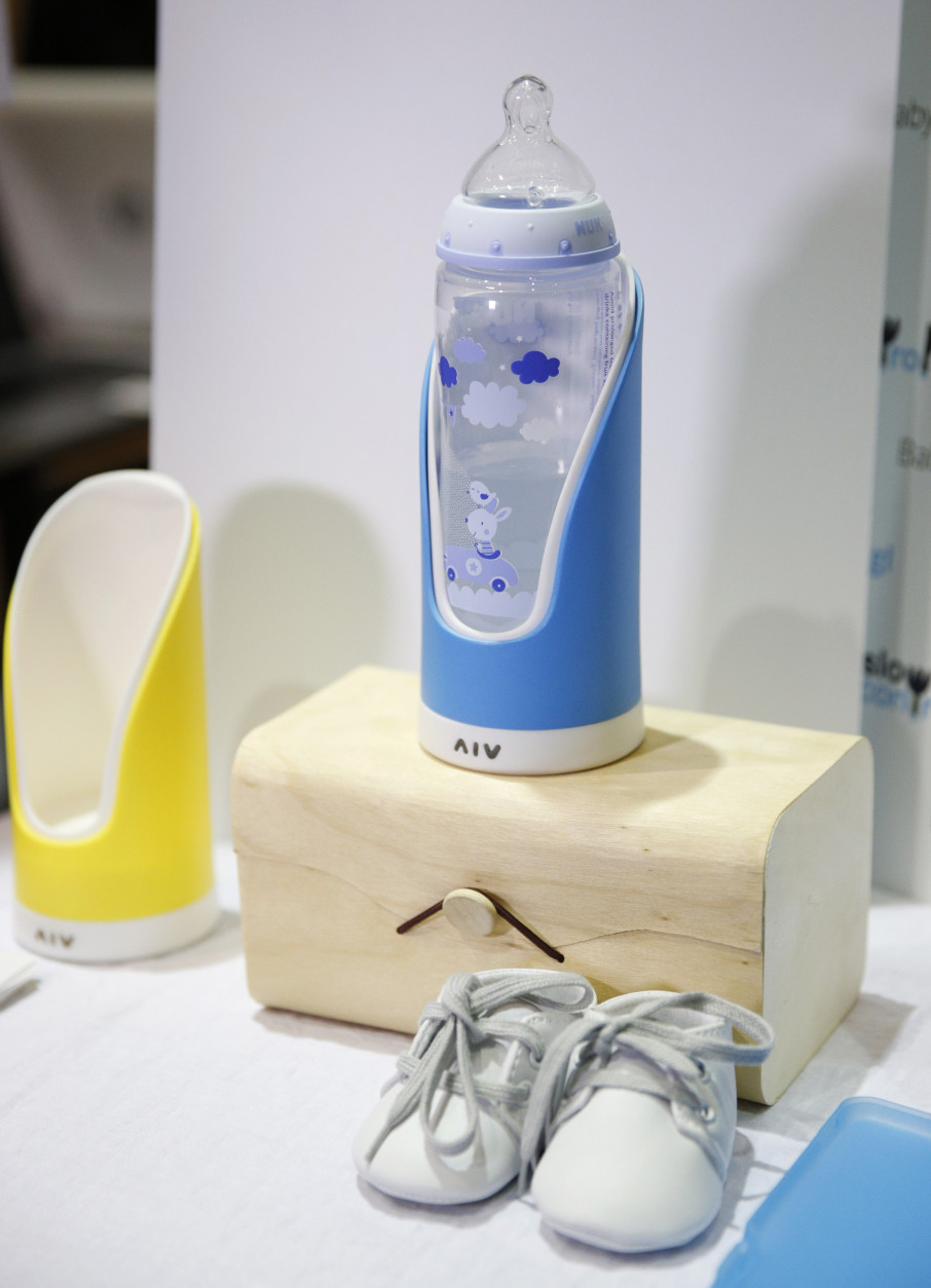 The Baby Glgl by Slow Control is on display at CES Unveiled, a media preview event for CES International, Sunday, Jan. 4, 2015, in Las Vegas. The device holds a baby bottle and can record how fast and how much a baby is drinking and it can send that information to a mobile device. (AP Photo/John Locher)
