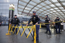 Metro Transit Police officers, secure the entrance to LEnfant Plaza Station in Washington, Monday, Jan. 12, 2015.  Metro officials say one of the busiest stations in downtown Washington has been evacuated because of smoke.  (AP Photo/Manuel Balce Ceneta)