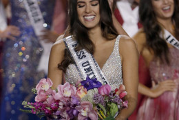 Miss Colombia Paulina Vega smiles as the the crown is placed on her head as she becomes Miss Universe during the Miss Universe pageant in Miami, Sunday, Jan. 25, 2015. (AP Photo/Wilfredo Lee)