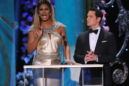 Laverne Cox, left, and Matt McGorry present the award for outstanding performance by a female actor in a drama series on stage at the 21st annual Screen Actors Guild Awards at the Shrine Auditorium on Sunday, Jan. 25, 2015, in Los Angeles. (Photo by Vince Bucci/Invision/AP)