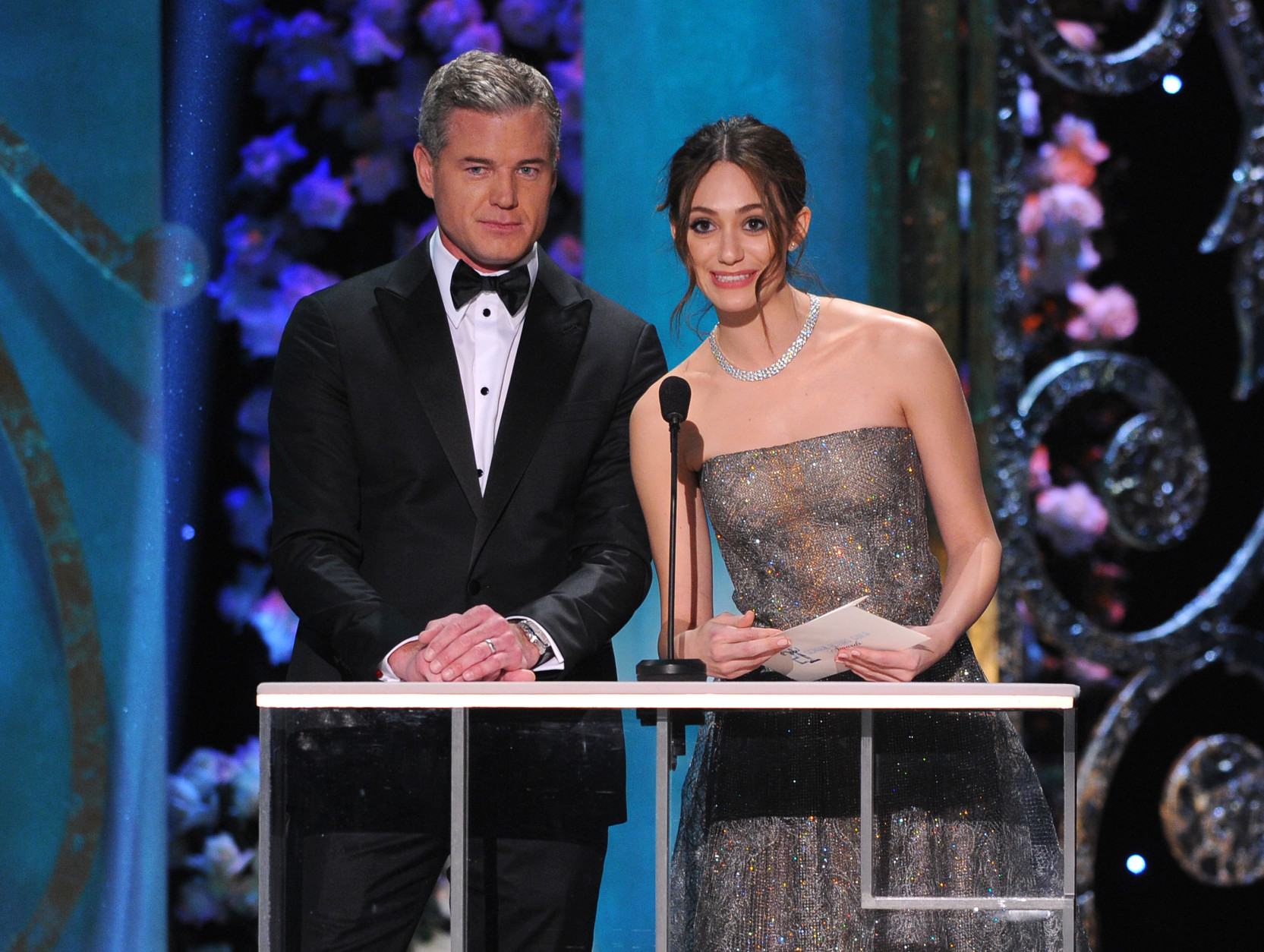 Eric Dane, left, and Emmy Rossum present the award for outstanding performance by a male actor in a drama series at the 21st annual Screen Actors Guild Awards at the Shrine Auditorium on Sunday, Jan. 25, 2015, in Los Angeles. (Photo by Vince Bucci/Invision/AP)