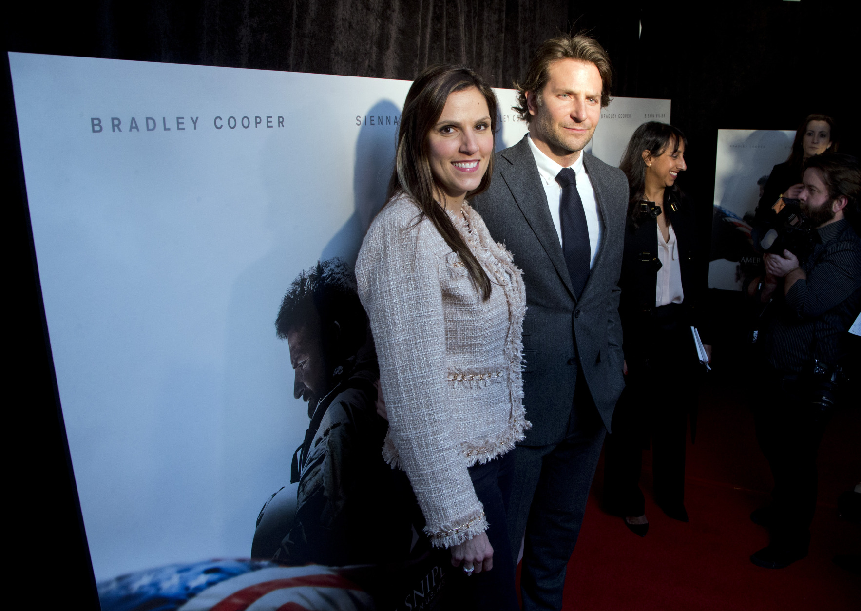 Actor Bradley Cooper and Taya Kyle, left, widow of US Navy SEAL Chris Kyle, arrive at the Washington premiere of the movie American Sniper at Burke Theatre at the U.S. Navy Memorial in Washington, Tuesday, Jan. 13, 2015. Cooper played Chris Kyle, the deadliest sniper in American military history and author of the book American Sniper," made into a movie with the same title.  (AP Photo/Manuel Balce Ceneta)