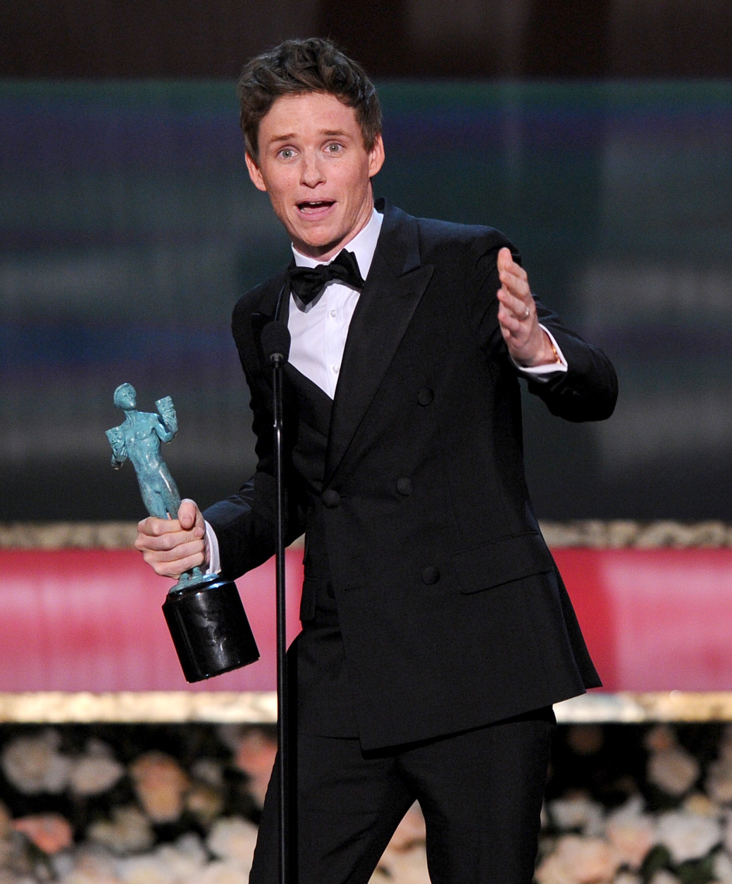 Eddie Redmayne accepts the award for outstanding performance by a male actor in a leading role for The Theory of Everything at the 21st annual Screen Actors Guild Awards at the Shrine Auditorium on Sunday, Jan. 25, 2015, in Los Angeles. (Photo by Vince Bucci/Invision/AP)