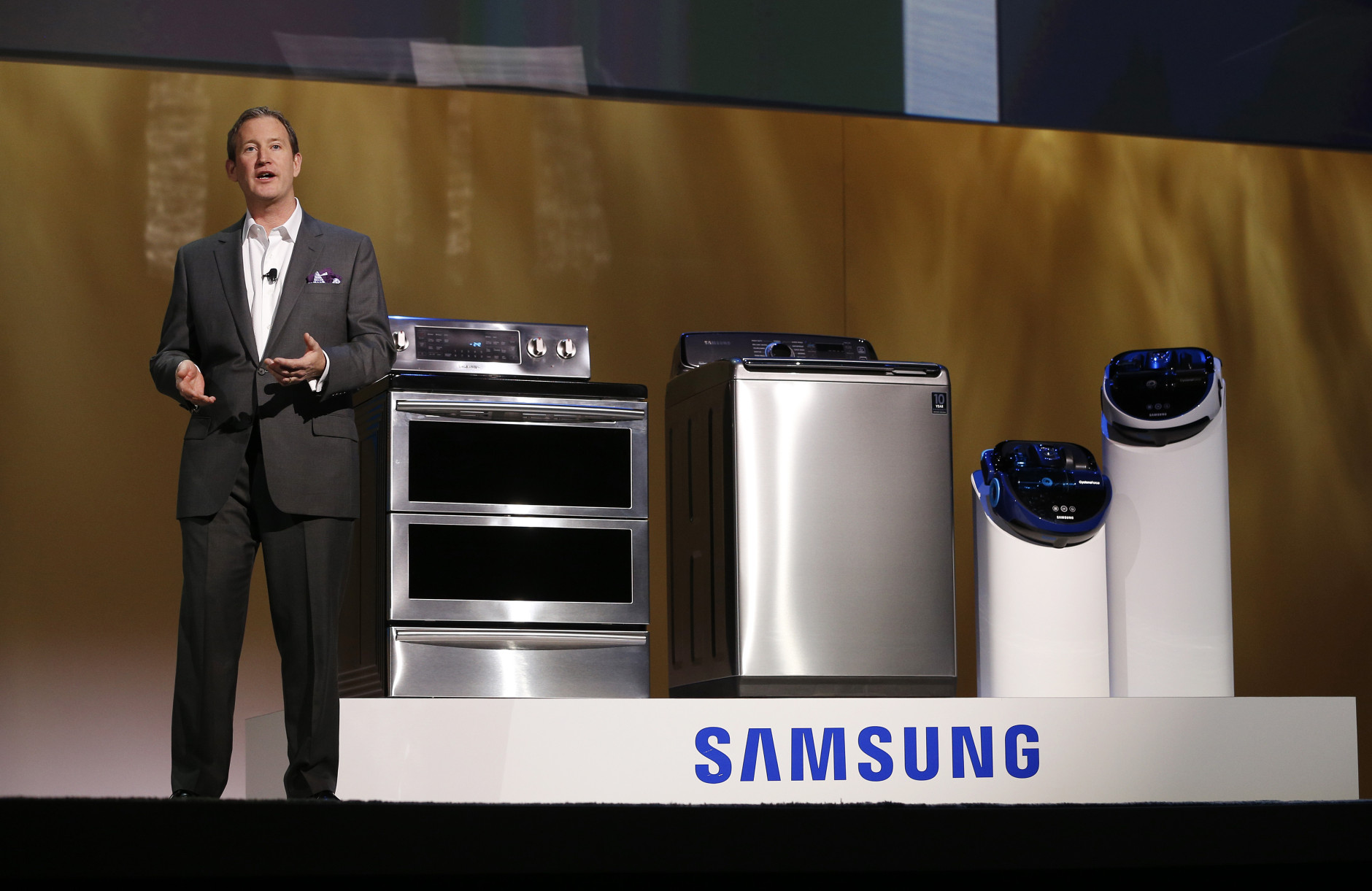 John Herrington, senior vice president of Samsung Electronics America, talks about new appliances during a Samsung news conference at the International CES Monday, Jan. 5, 2015, in Las Vegas. (AP Photo/John Locher)