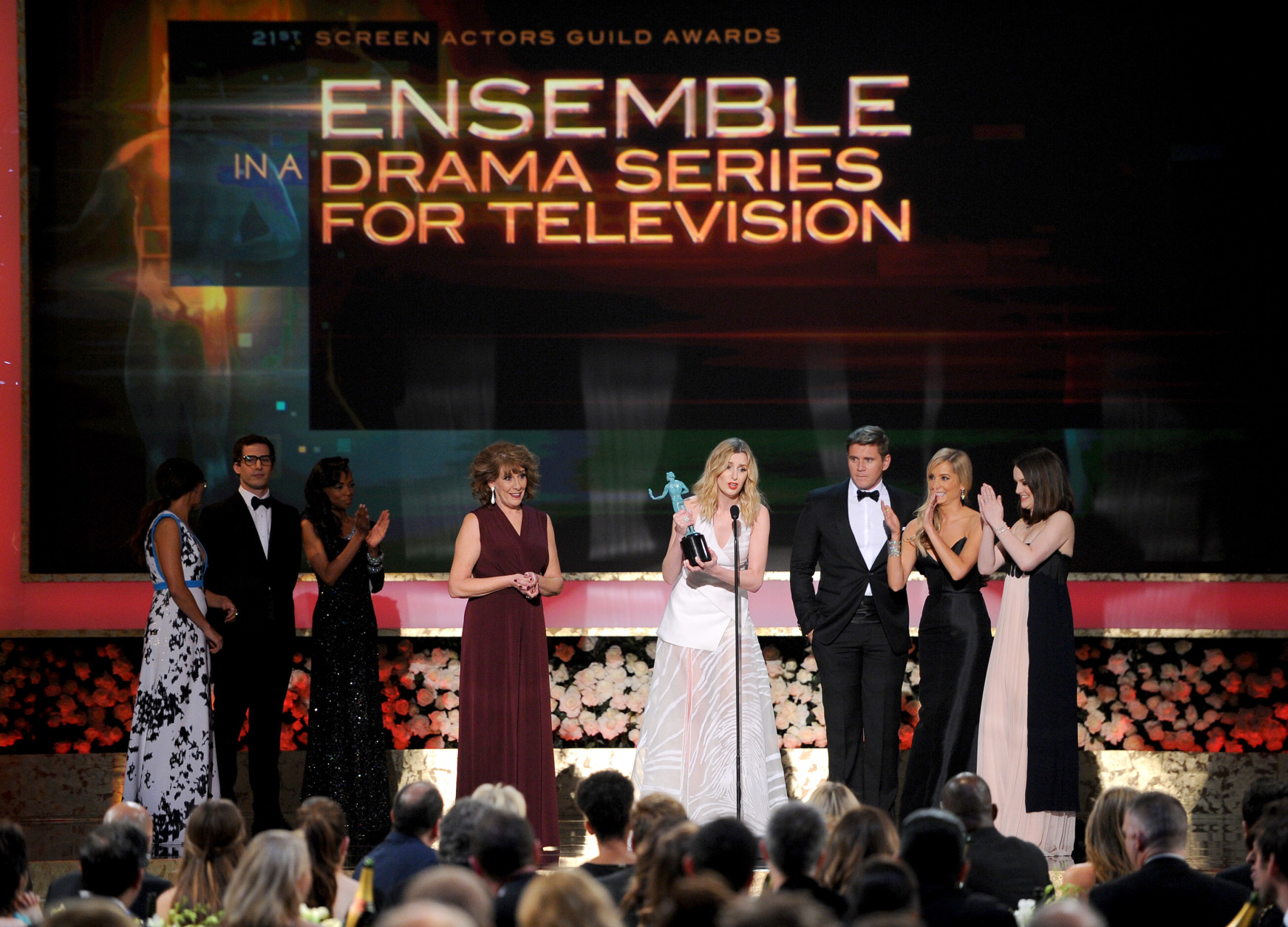 Joanne Froggatt, center, accepts the award for outstanding performance by a ensemble in a drama series for Downton Abbey next to fellow cast members on stage during the 21st annual Screen Actors Guild Awards at the Shrine Auditorium on Sunday, Jan. 25, 2015, in Los Angeles. (Photo by Vince Bucci/Invision/AP)