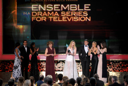 Joanne Froggatt, center, accepts the award for outstanding performance by a ensemble in a drama series for Downton Abbey next to fellow cast members on stage during the 21st annual Screen Actors Guild Awards at the Shrine Auditorium on Sunday, Jan. 25, 2015, in Los Angeles. (Photo by Vince Bucci/Invision/AP)