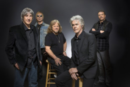 This June 2014 photo provided by Three Dog Night shows, band members, Cory Wells, from left, Paul Kingery, Michael Allsup, Danny Hutton, and Pat Bautz of the music group, Three Dog Night, posing for a portrait, in Las Vegas. Wells, a founding member of the popular 1970s band and lead singer on such hits as "Never Been to Spain" and "Mama Told Me (Not to Come)," has died at age 74. Wells, pictured in the forefront, experienced acute back pain weeks ago and died suddenly Tuesday, Oct. 20, 2015, in Dunkirk, where he had lived, bandmate Hutton said.  (Steve Spatafore/Three Dog Night via AP)