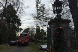 In this file photo, Christmas decorations hang on the entry gate to a mansion on Childs Point Road that burned to the ground, Jan. 19, 2015. A source tells ABC7 that Christmas lights were the source of the fire. (WTOP/Kate Ryan)