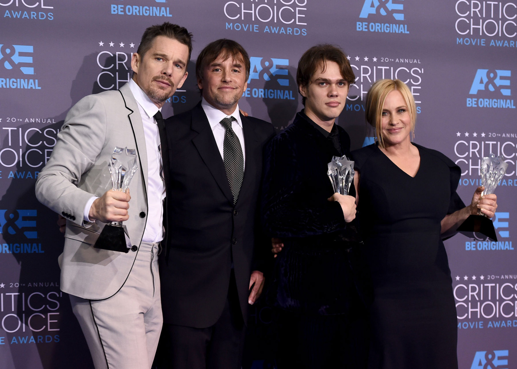 Ethan Hawke, from left, Richard Linklater, Ellar Coltrane and Patricia Arquette, of “Boyhood”, pose with the best picture award in the press room at the 20th annual Critics' Choice Movie Awards at the Hollywood Palladium on Thursday, Jan. 15, 2015, in Los Angeles. (Photo by Jordan Strauss/Invision/AP)