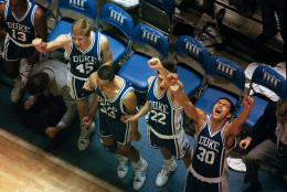 Duke Blue Devils celebrate as they beat North Carolina to win the Atlantic Coast Conference tournament championship in Greensboro Coliseum on March 13, 1988. From left: Clay Buckley (45), John Smith (33), Greg Koubek (22) and Alaa Abdelnaby (30). (AP Photo/Steve Helber)