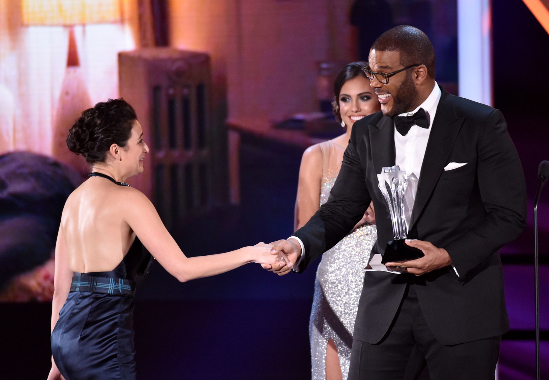 

Tyler Perry, right, presents Jenny Slate with the best actress in a comedy award for “Obvious Child” at the 20th annual Critics' Choice Movie Awards at the Hollywood Palladium on Thursday, Jan. 15, 2015, in Los Angeles. (Photo by John Shearer/Invision/AP)
