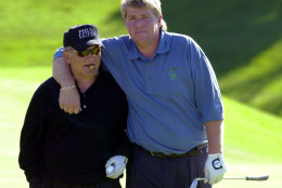 Joe Pesci and John Daly share a moment on the course in 2001. (AP Photo/Don Heupel)