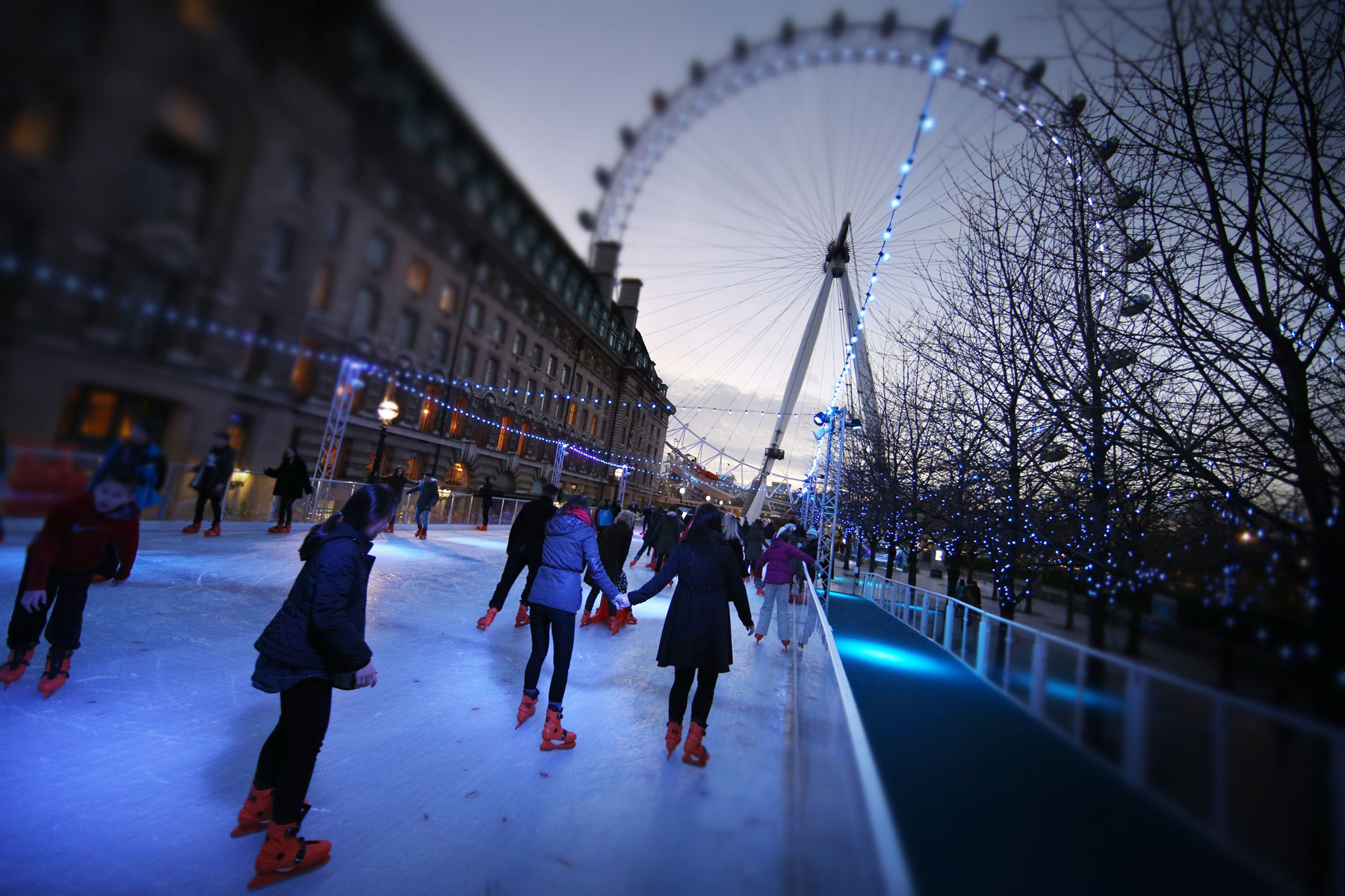 London Eye (EDITORS NOTE: This image has been processed with digital filters). LONDON, ENGLAND - DECEMBER 15: (EDITORS NOTE: This image has been processed with digital filters). People skate on the ice rink near The London Eye on December 15, 2014 in London, England. Currently 12 seasonal ice rinks function during winter in London. (Photo by Peter Macdiarmid/Getty Images)