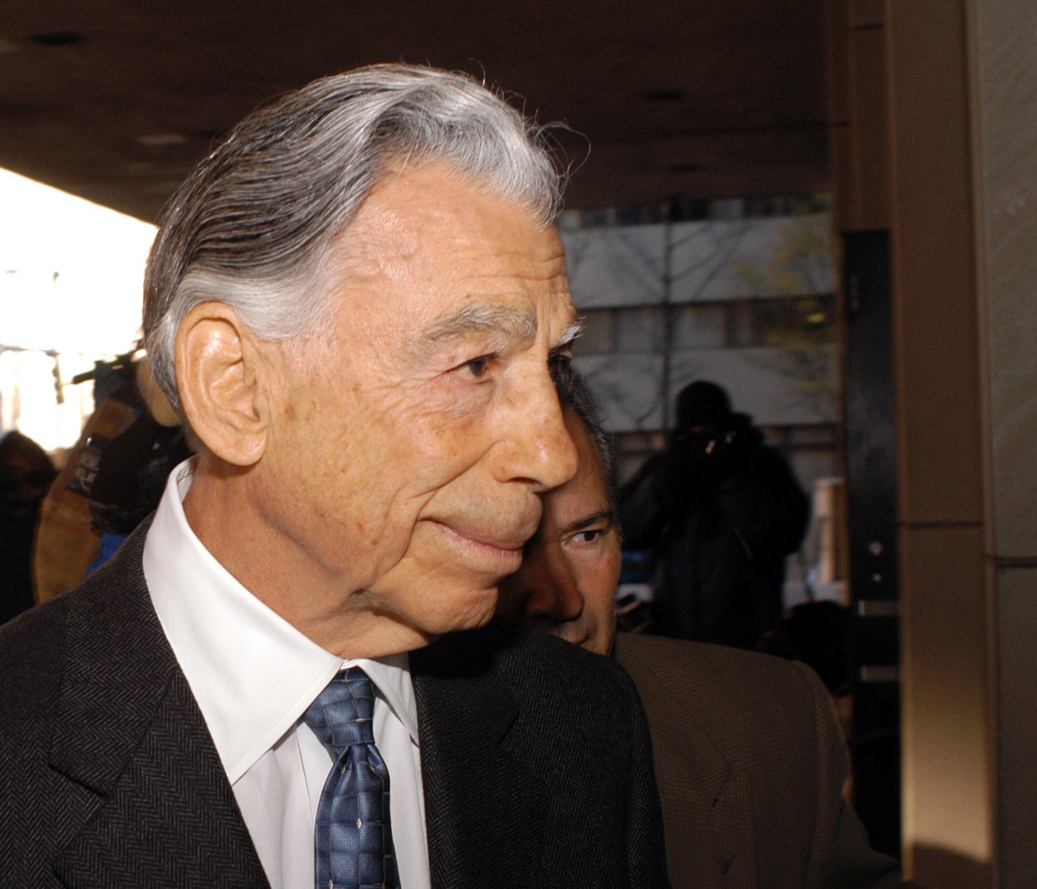 WILMINGTON, DE - DECEMBER 2:  Billionaire investor Kirk Kerkorian arrives at the J. Caleb Boggs Federal Building to testify in his lawsuit against Daimler Chrysler AG December 2, 2003 in Wilmington, Delaware. Kerkorian, whose Tracinda Corp. was Chrysler's largest shareholder until it merged with Daimler-Benz, alledges that Daimler-Benz officials commited fraud during merger talks in 1998.  (Photo by William Thomas Cain/Getty Images)