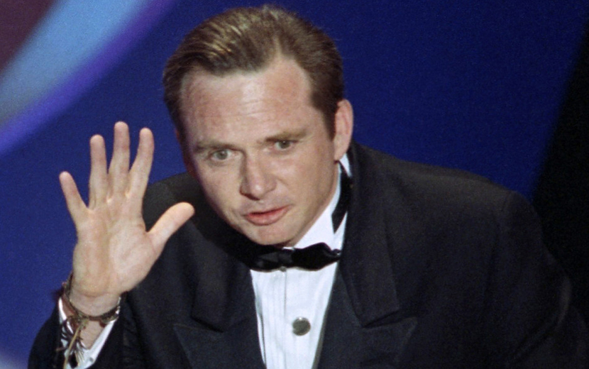 FILE - This March 26, 1991 file photo shows Michael Blake accepting the Oscar for best adapted screenplay for "Dances with Wolves" at the 63rd Annual Academy Awards in Los Angeles. Blake's business partner, Daniel Ostroff, says the 69-year-old died Saturday in Tucson, Ariz., after a long battle with cancer.  (AP Photo/Reed Saxon, File)