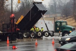 Men work to repair a broken water main on northbound Route 29. (WTOP/Rob Stallworth)