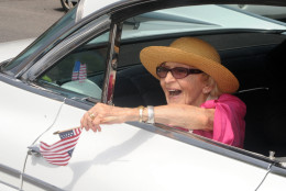 In this June 30, 2012 file photo, parade grand marshall actress Ellen Albertini Dow waves to the crowd as she rides in the back of a classic car during the Six-County Firemen's Parade in Mount Carmel, Northumberland County. Dow, a feisty and fiercely independent character actor best known for her salty rendition of Rappers Delight in The Wedding Singer, died Monday, May 4, 2015, according to her agent Juliet Green. She was 101.  (Mike Staugaitis/The News-Item via AP, File)