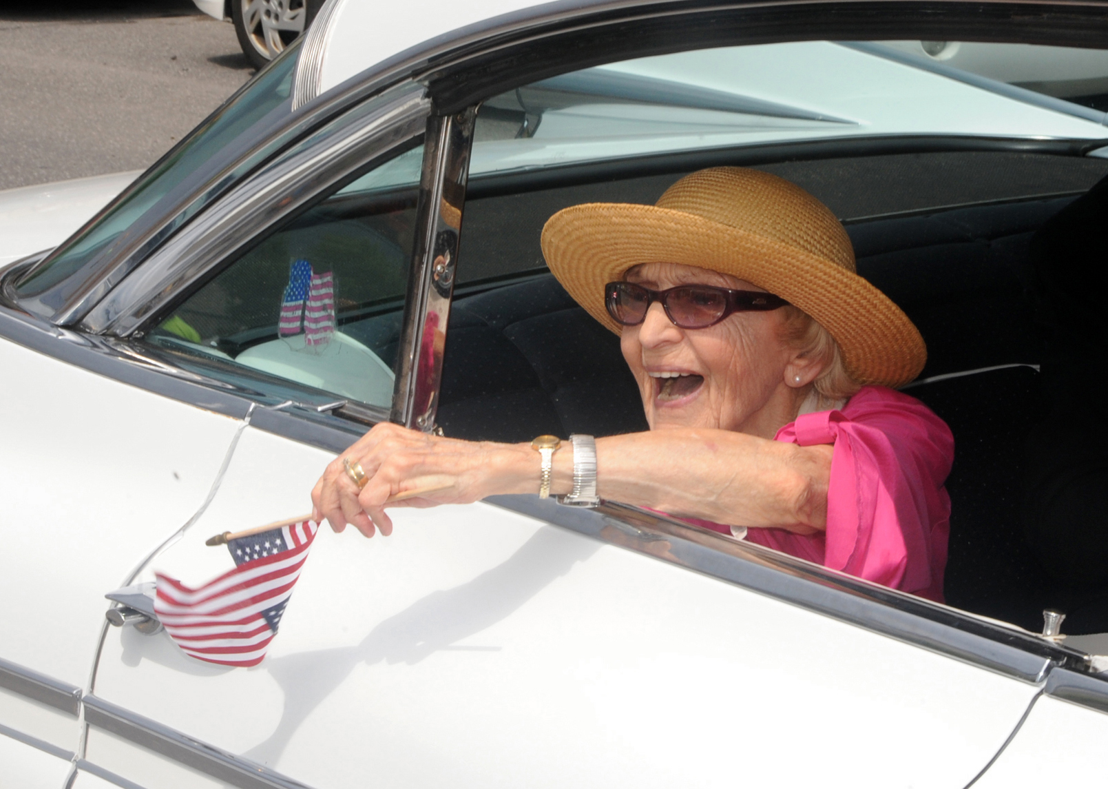 In this June 30, 2012 file photo, parade grand marshall actress Ellen Albertini Dow waves to the crowd as she rides in the back of a classic car during the Six-County Firemen's Parade in Mount Carmel, Northumberland County. Dow, a feisty and fiercely independent character actor best known for her salty rendition of Rappers Delight in The Wedding Singer, died Monday, May 4, 2015, according to her agent Juliet Green. She was 101.  (Mike Staugaitis/The News-Item via AP, File)