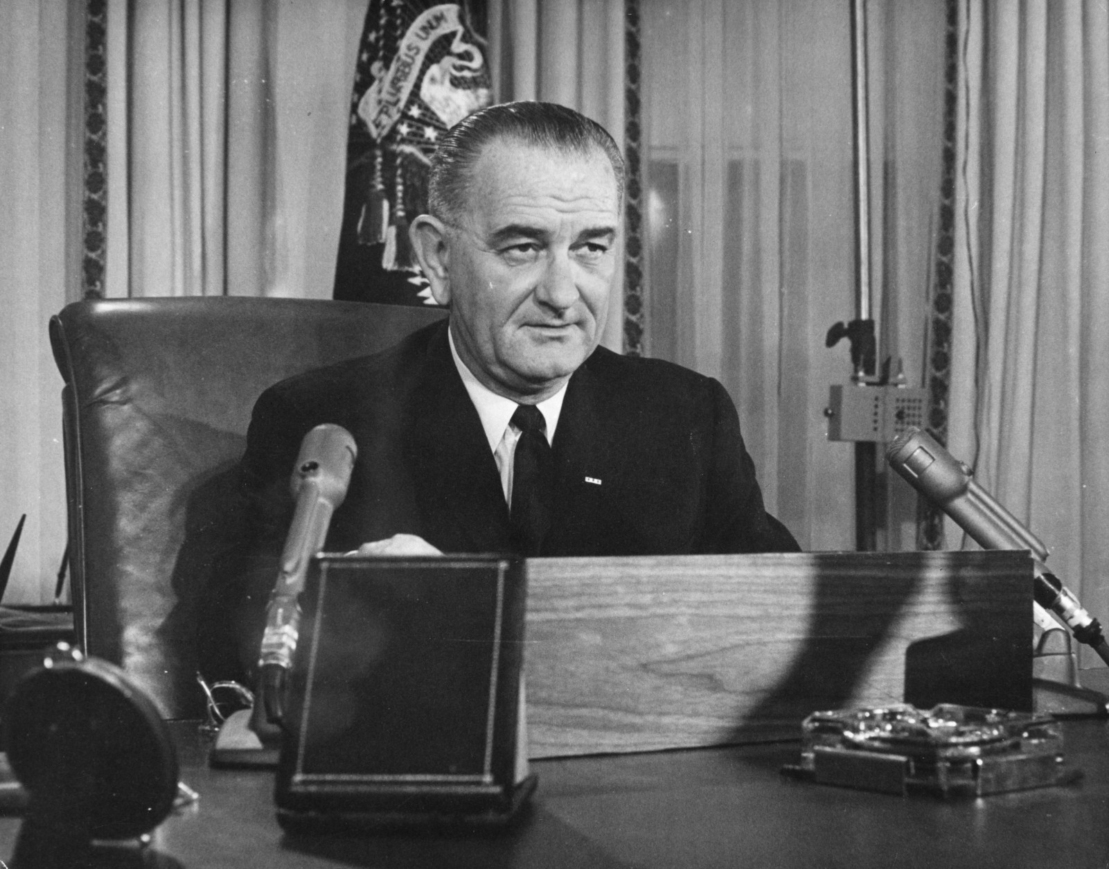 2nd December 1963:  American President Lyndon Baines Johnson addresses the nation on his first thanksgiving day television programme, broadcast from the executive offices of the White House.  (Photo by Keystone/Getty Images)