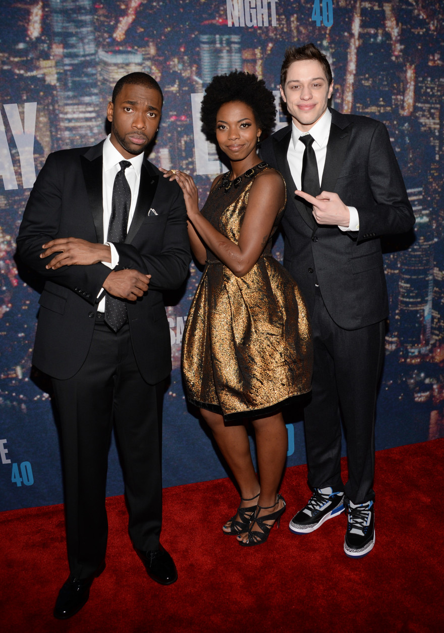 Jay Pharoah, from left, Sasheer Zamata and Pete Davidson arrive at the Saturday Night Live 40th Anniversary Special at Rockefeller Plaza on Sunday, Feb. 15, 2015, in New York. (Photo by Evan Agostini/Invision/AP)