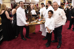 Wolfgang Puck, right, arrives at the Oscars on Sunday, Feb. 22, 2015, at the Dolby Theatre in Los Angeles. (Photo by Chris Pizzello/Invision/AP)