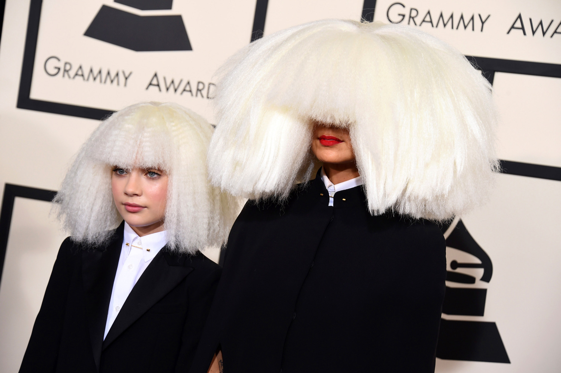 Sia, right, and Maddie Ziegler arrive at the 57th annual Grammy Awards at the Staples Center on Sunday, Feb. 8, 2015, in Los Angeles. (Photo by Jordan Strauss/Invision/AP)