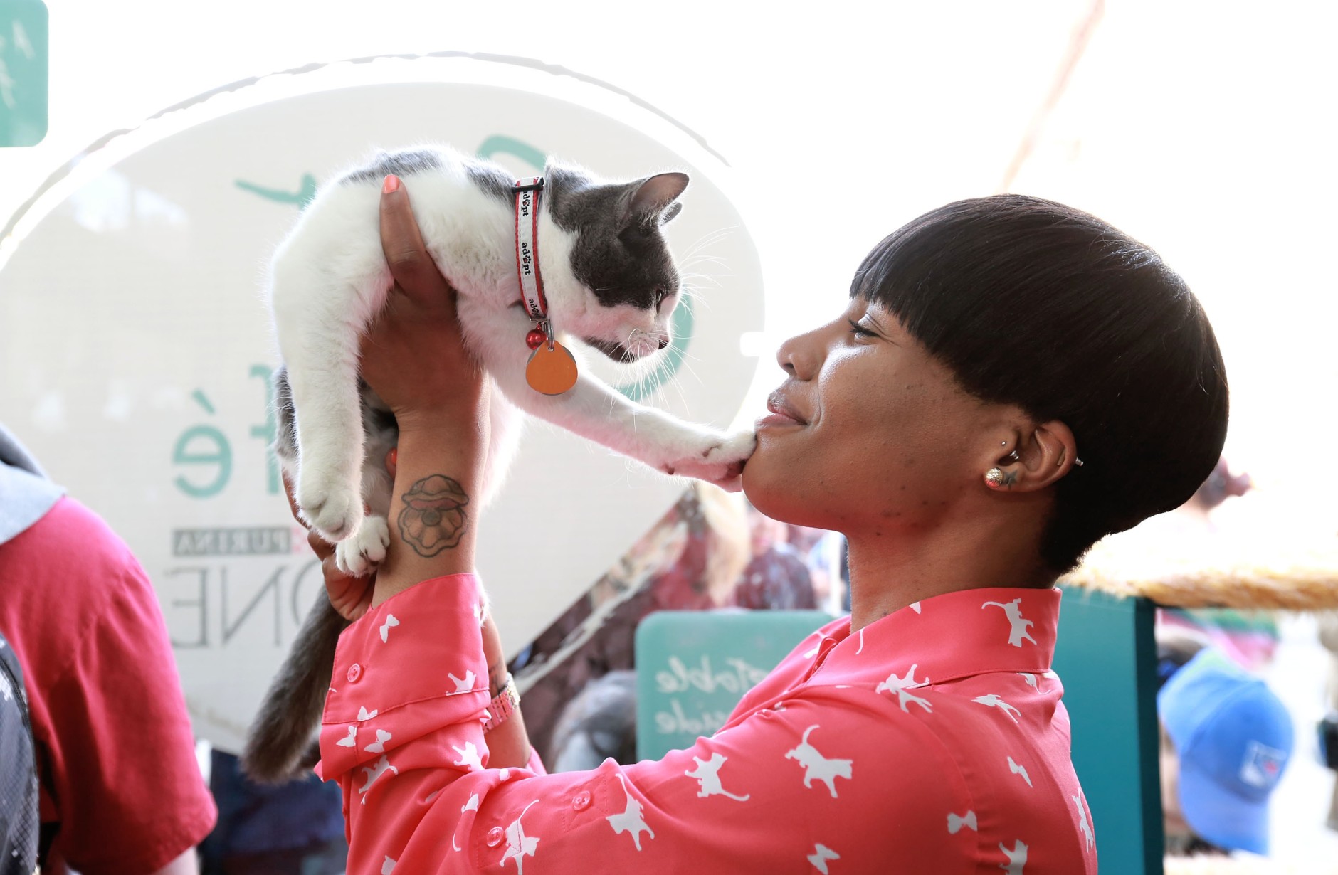IMAGE DISTRIBUTED FOR PURINA ONE - Victoria Mills prepares to take Sushi, her newly adopted cat, home during the adoption drive taking place at the Cat Cafe by Purina ONE on Sunday, April 27, 2014, in New York. (Photo by Amy Sussman/Invision for Purina ONE/AP Images)