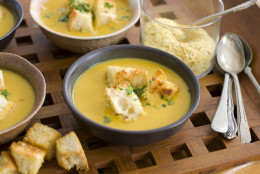 In this image taken on Feb. 13, 2012, nutritional yeast flakes lend a savory, cheesy flavor to this winter-friendly pumpkin and white bean soup with sourdough croutons as shown in Concord, N.H. (AP Photo/Matthew Mead)