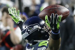 Seattle Seahawks wide receiver Chris Matthews (13) celebrates after catching an 11-yard touchdown pass against the New England Patriots during the first half of NFL Super Bowl XLIX football game Sunday, Feb. 1, 2015, in Glendale, Ariz. (AP Photo/Brynn Anderson)