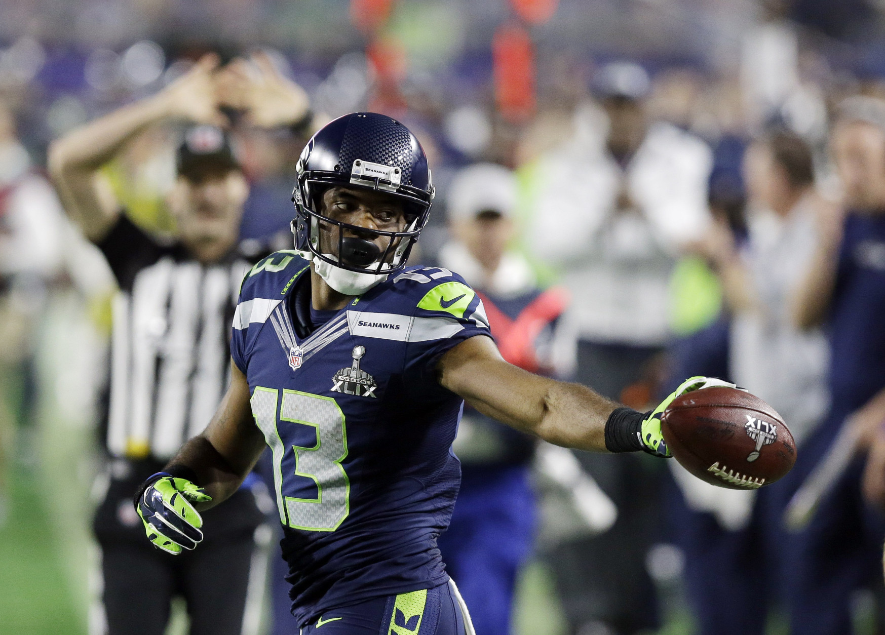 Seattle Seahawks wide receiver Chris Matthews (13) tosses the ball to the ref after he made a catch during the second half of NFL Super Bowl XLIX football game against the New England Patriots on Sunday, Feb. 1, 2015, in Glendale, Ariz. (AP Photo/Brynn Anderson)