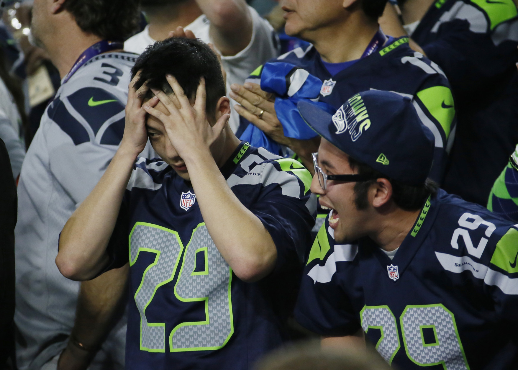 Seattle Seahawks fans react during the second half of the NFL Super Bowl XLIX football game between Seahawks and the New England Patriots Sunday, Feb. 1, 2015, in Glendale, Ariz. (AP Photo/Matt York)