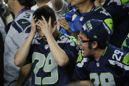 Seattle Seahawks fans react during the second half of the NFL Super Bowl XLIX football game between Seahawks and the New England Patriots Sunday, Feb. 1, 2015, in Glendale, Ariz. (AP Photo/Matt York)