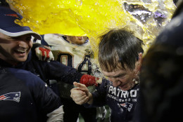 New England Patriots head coach Bill Belichick is doused by sports drink after NFL Super Bowl XLIX football game against the Seattle Seahawks Sunday, Feb. 1, 2015, in Glendale, Ariz. The Patriots won 28-24. (AP Photo/Matt Slocum)