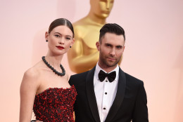 Adam Levine, right, and Behati Prinsloo arrive at the Oscars on Sunday, Feb. 22, 2015, at the Dolby Theatre in Los Angeles. (Photo by Jordan Strauss/Invision/AP)