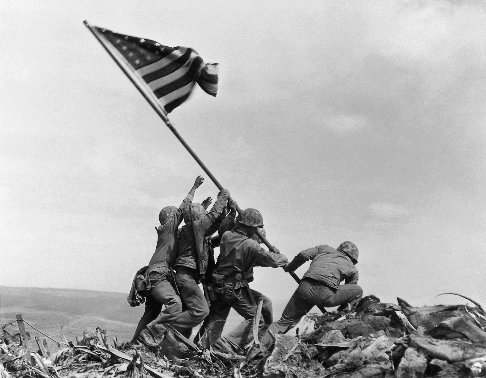 FILE - In this Feb. 23, 1945, file photo, U.S. Marines of the 28th Regiment, 5th Division, raise a U.S. flag atop Mount Suribachi, Iwo Jima. Two Gastonia, N.C., men, Joseph Tedder, 90, and Mack Drake, 89, fought alongside more than 70,000 Marines, sailors and airmen on Iwo Jima, a tiny 8-square mile speck of volcanic rock and sand midway between Guam and Tokyo, during the closing months of World War II. (AP Photo/Joe Rosenthal, File)